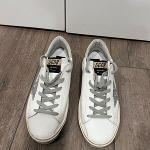 Golden Goose Hi Star Sneakers in white leather. Sliver glitter star w/ gold heel